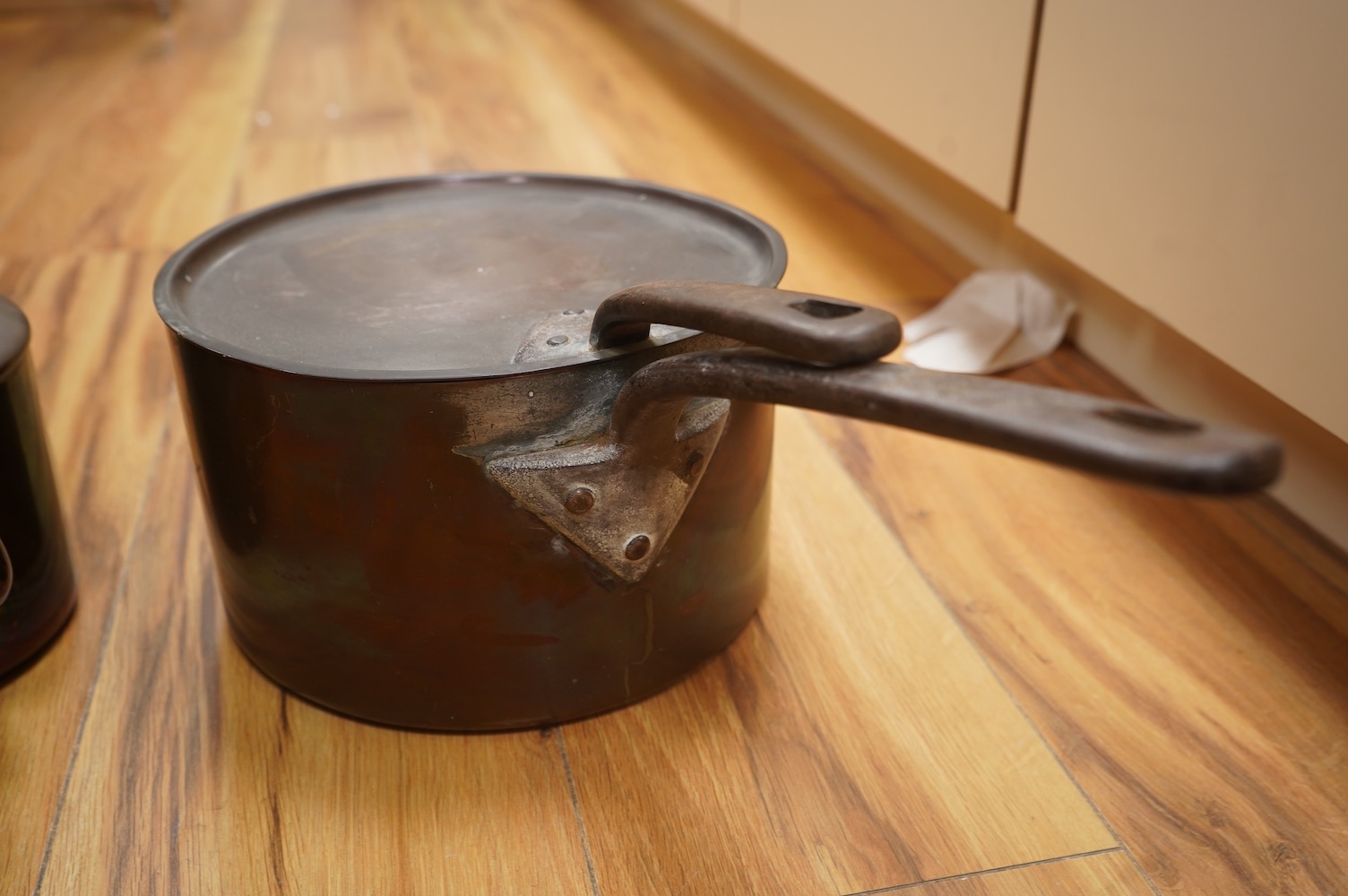 Two Benham & Froud copper saucepans and a copper kettle, largest 43cm in length